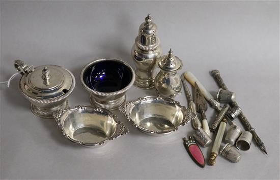 A group of silver including a three piece condiment set, London, 1962, sterling dishes, bookmark and enamelled cigar cutter etc.